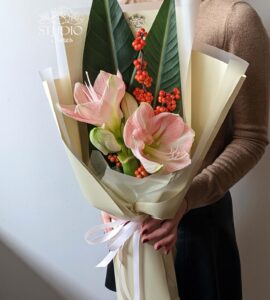 Bouquet with amaryllis and ilex