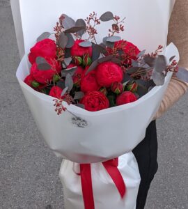 Bouquet of eleven red piano roses with eucalyptus