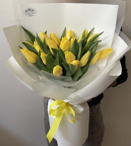 Bouquet of nineteen yellow tulips
