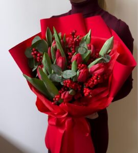 Bouquet of seventeen tulips with ilex