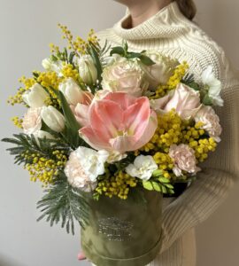 Flowers in a box with amaryllis and mimosa