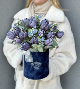 Bouquet of purple tulips in a box