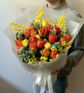 Bouquet of tulips with mimosa and oxypetalum