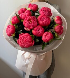 Bouquet of thirteen coral peonies