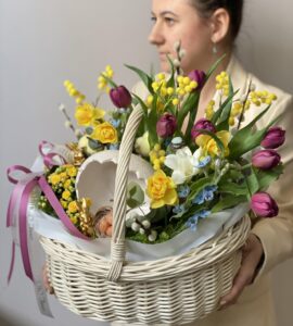 Easter basket with tulips and mimosa