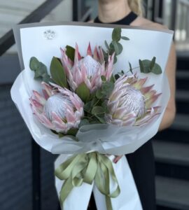 Bouquet of three pink king proteas