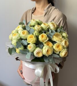 Bouquet of nineteen roses  Piony in a box