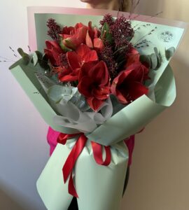 Bouquet with amaryllis and skimia