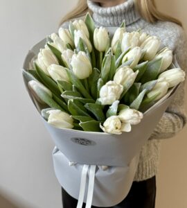 Bouquet of twenty-five white snow-covered tulips