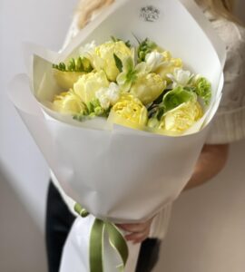 Bouquet of yellow tulips with freesia 'Yolk'