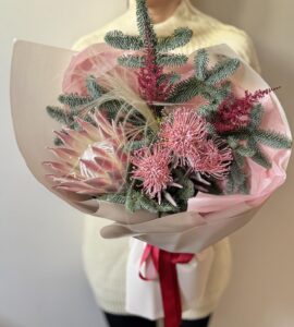 Winter bouquet with protea and leucospermum