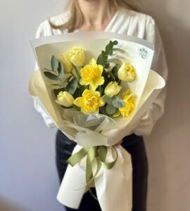 An inexpensive bouquet with daffodils and tulips An inexpensive bouquet with daffodils and tulips